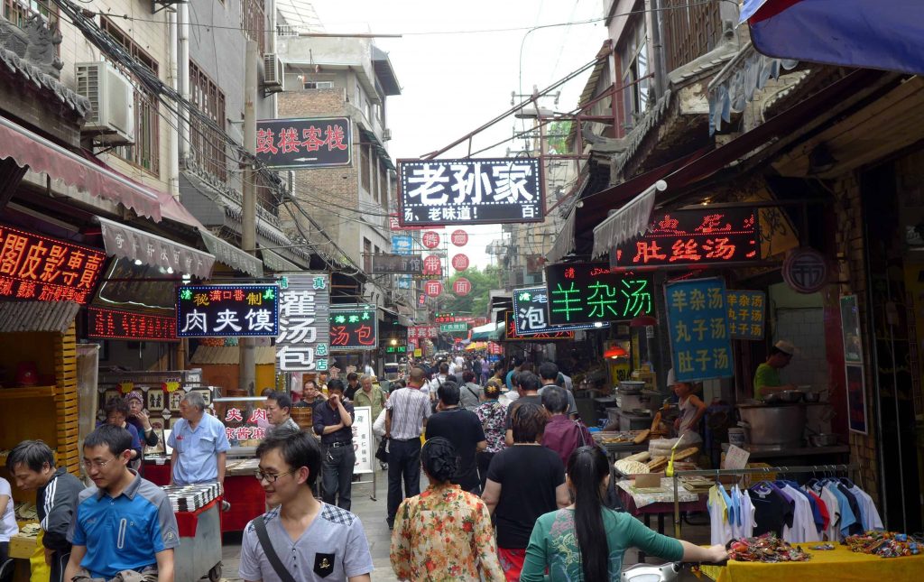 Xi’an Muslim Quarter food stalls with biangbiang noodles and local snacks
